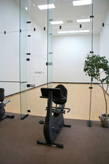 racquetball court with exercise bike