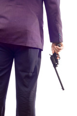 person in a suit holding a gun