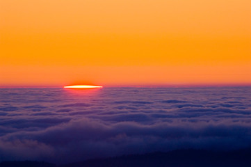 sunrise on top of pacific cloud deck