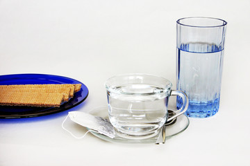 cup of tea, glass of water and cookies