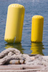 two yellow buoy