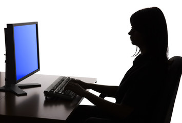 silhouette of woman working computer
