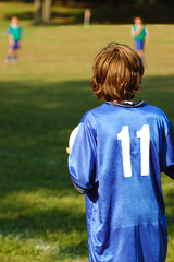 young boy playing soccer
