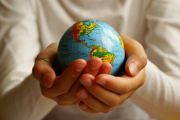 hands with globe