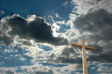 cross against bright clouds