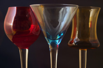 three colored cordial glasses