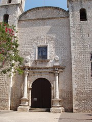 Fototapeta na wymiar textured stone facade of mexican church