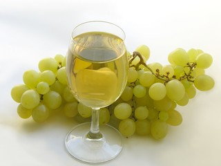 a glass of wine and grapes