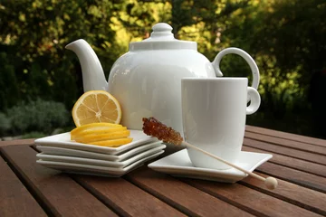 Papier Peint photo Theé cup of tea lemon slices and bowl