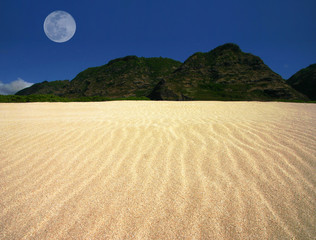 rippled sand landscape with offset moon