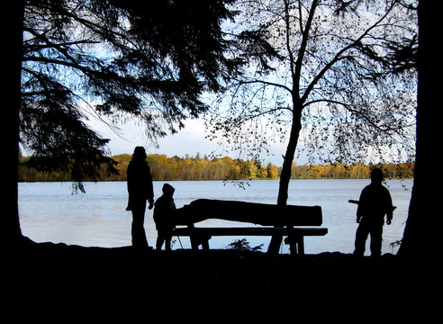 mother with kids at lake