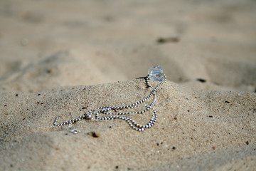 necklace in the sand