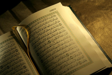 Fototapeta premium open book pages of holy koran