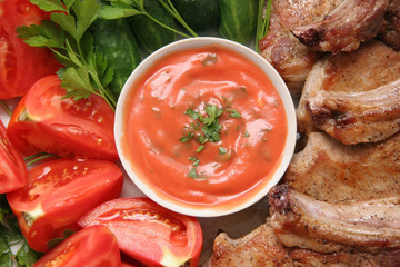 meat and vegetables with sauce.