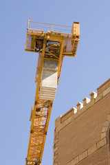 Fototapeta na wymiar construction crane next to a building