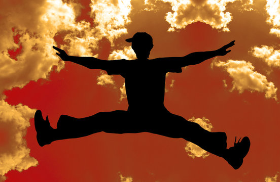 jumping boy - orange sky