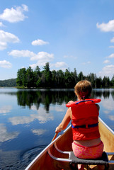 child in canoe