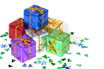 six brightly colored wrapped christmas presents