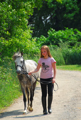 girl walk pony