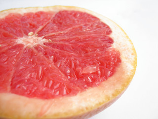 slice of grapefruit on a white background