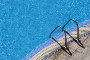 steps into hotel swimming pool