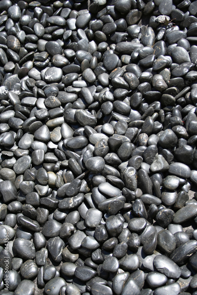 Wall mural black pebbles background