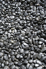 Fototapeta na wymiar black pebbles background