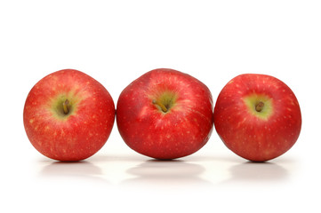 three red apples isolated on white