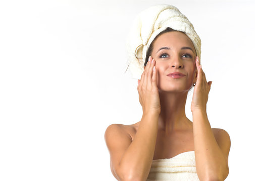 woman in towel apply cream