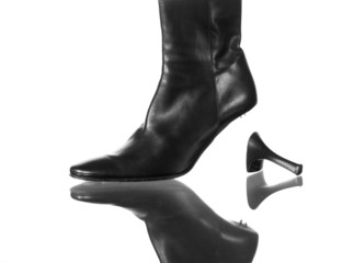 elegant black leather boot with a broken high heel