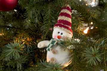 little snowman in a christmas tree