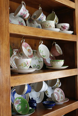 china cabinet full of cups