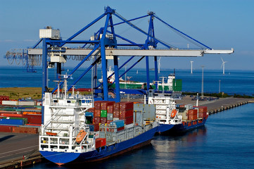 container ship and loading crane in port - obrazy, fototapety, plakaty
