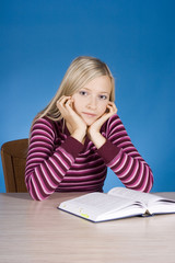 young blonde woman with open book