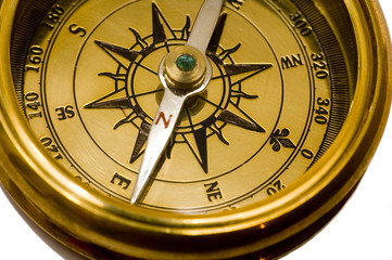 old style gold compass on white background