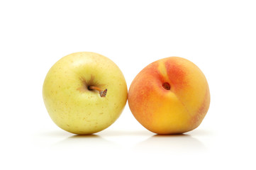 apple and peach isolated on white