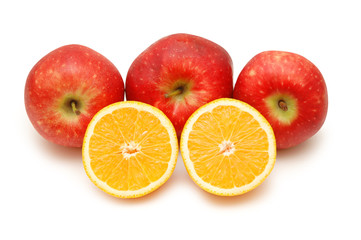 Fototapeta na wymiar three red apples and two half-cut oranges isolated