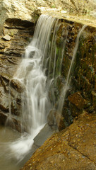 water flowing over ledge