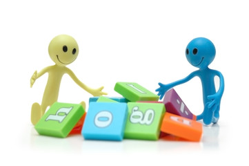 two smilies playing with alphabet letters