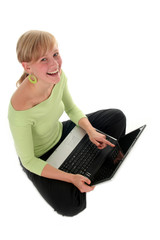 girl sitting on floor using laptop