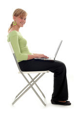 young woman sitting with laptop computer