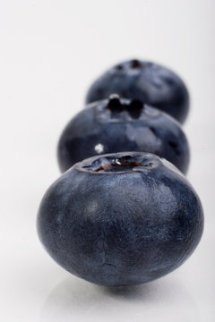 three blueberry lined up in a row
