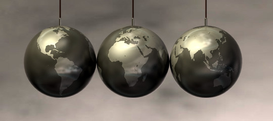 Three pendant Earth globes arranged in a row against a blurred gray background. Clear continent outlines and reflective surface.