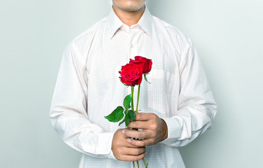 man holding a red roses