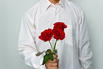 man holding a red roses
