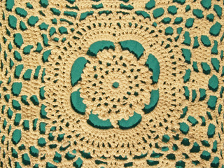 hand crocheted lace with green background