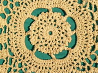 hand crocheted lace detail, with green background