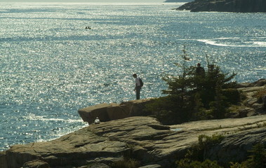 hiker on the cliffs in acadia national park