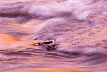turbulent river at sunset