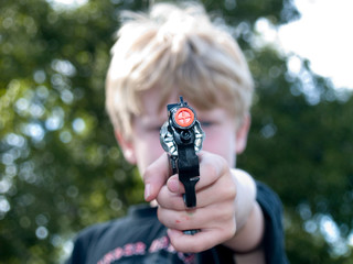boy and a toy gun